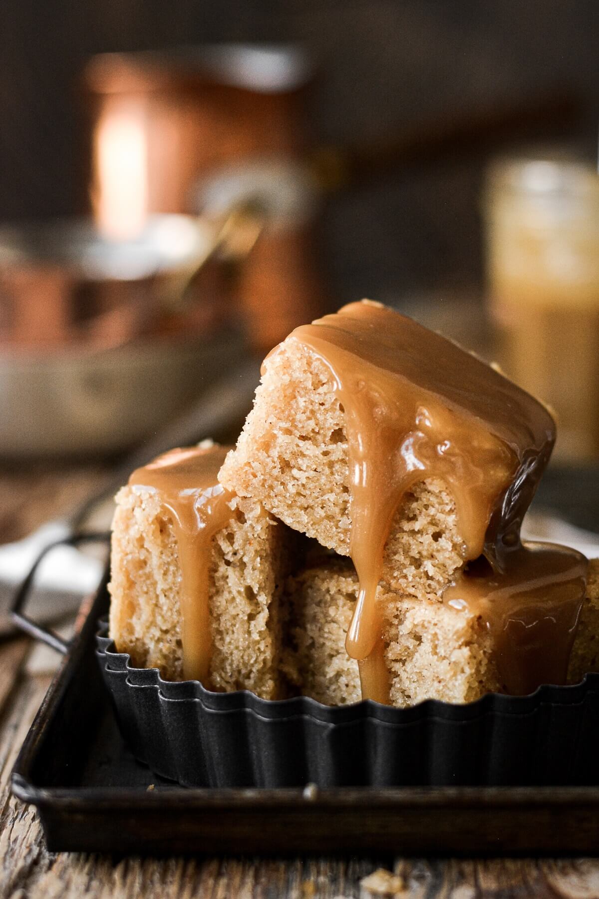 Squares of brown butter cake drizzled with toffee sauce.