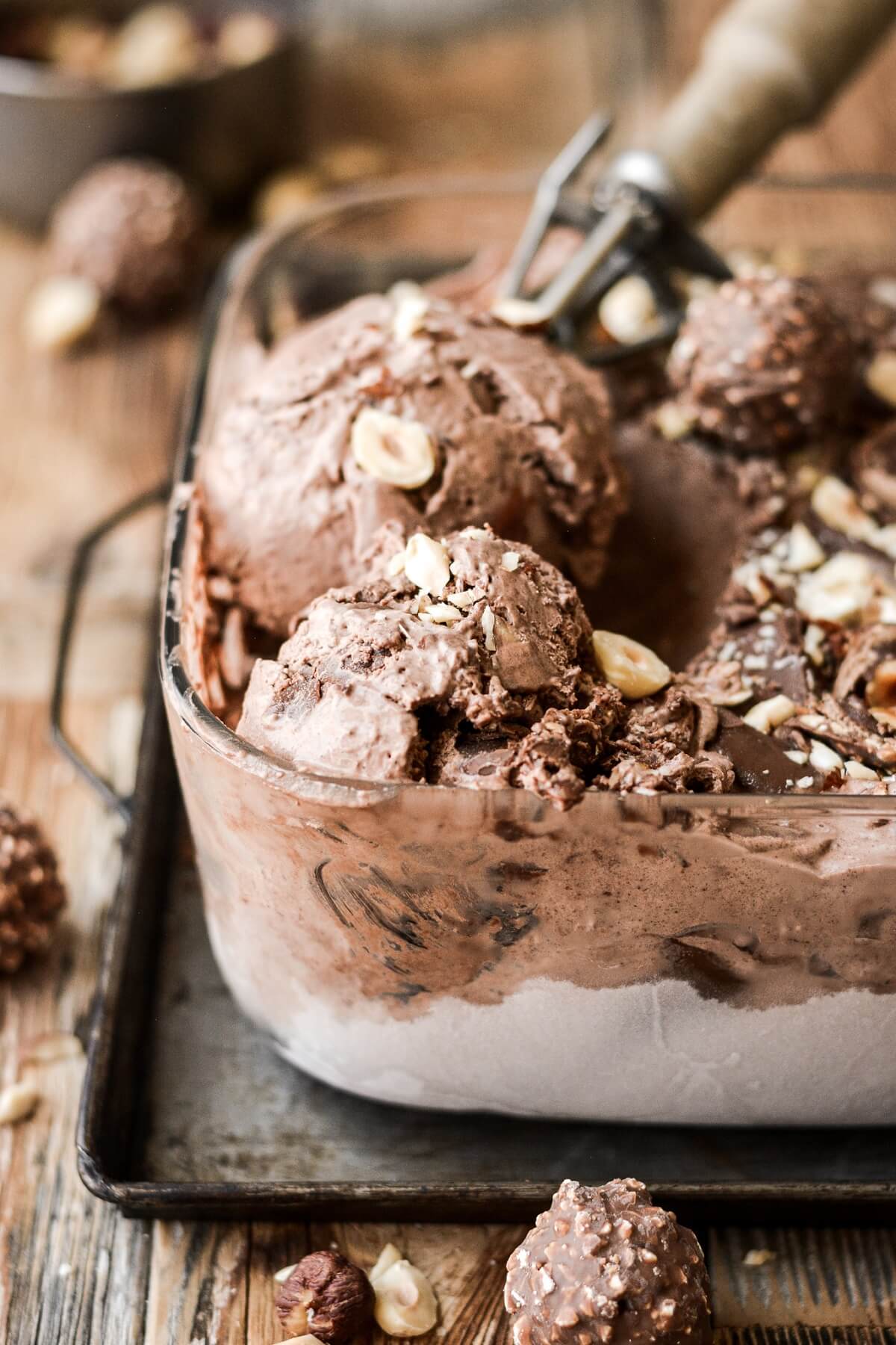Chocolate hazelnut ice cream in a glass dish.