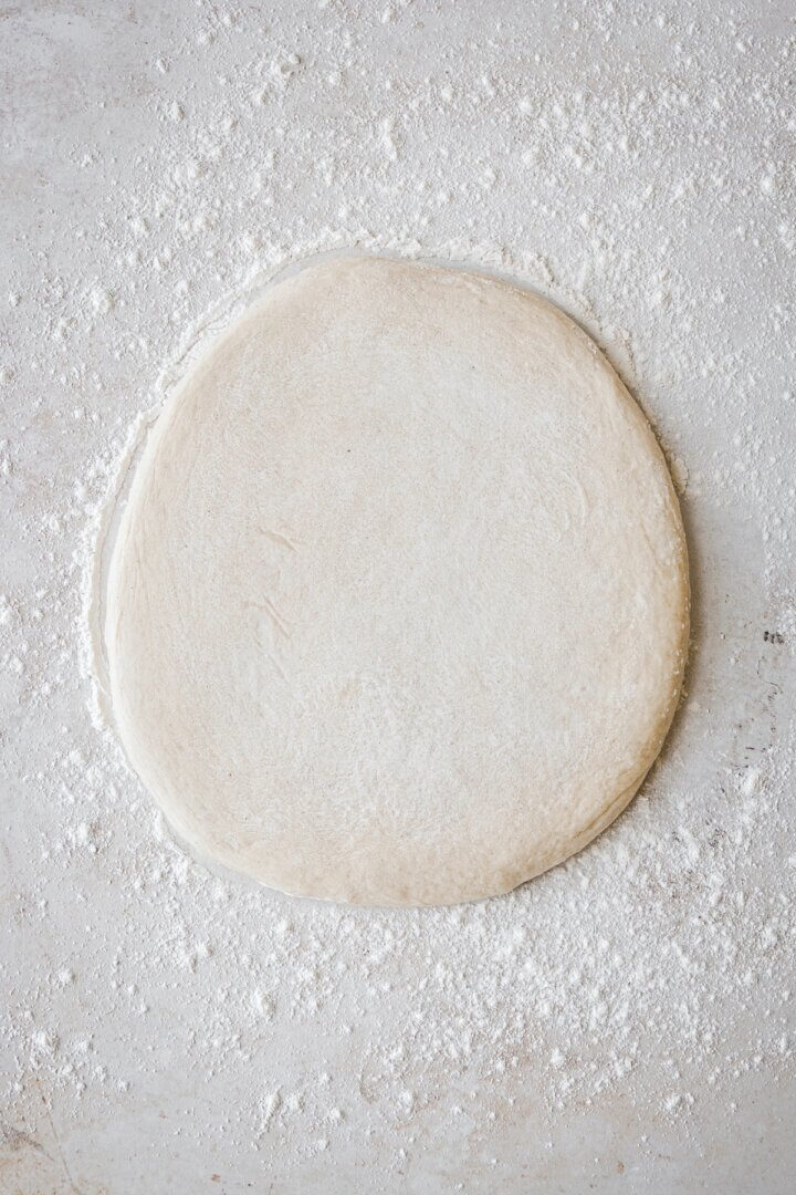 Doughnut dough rolled into an oval.