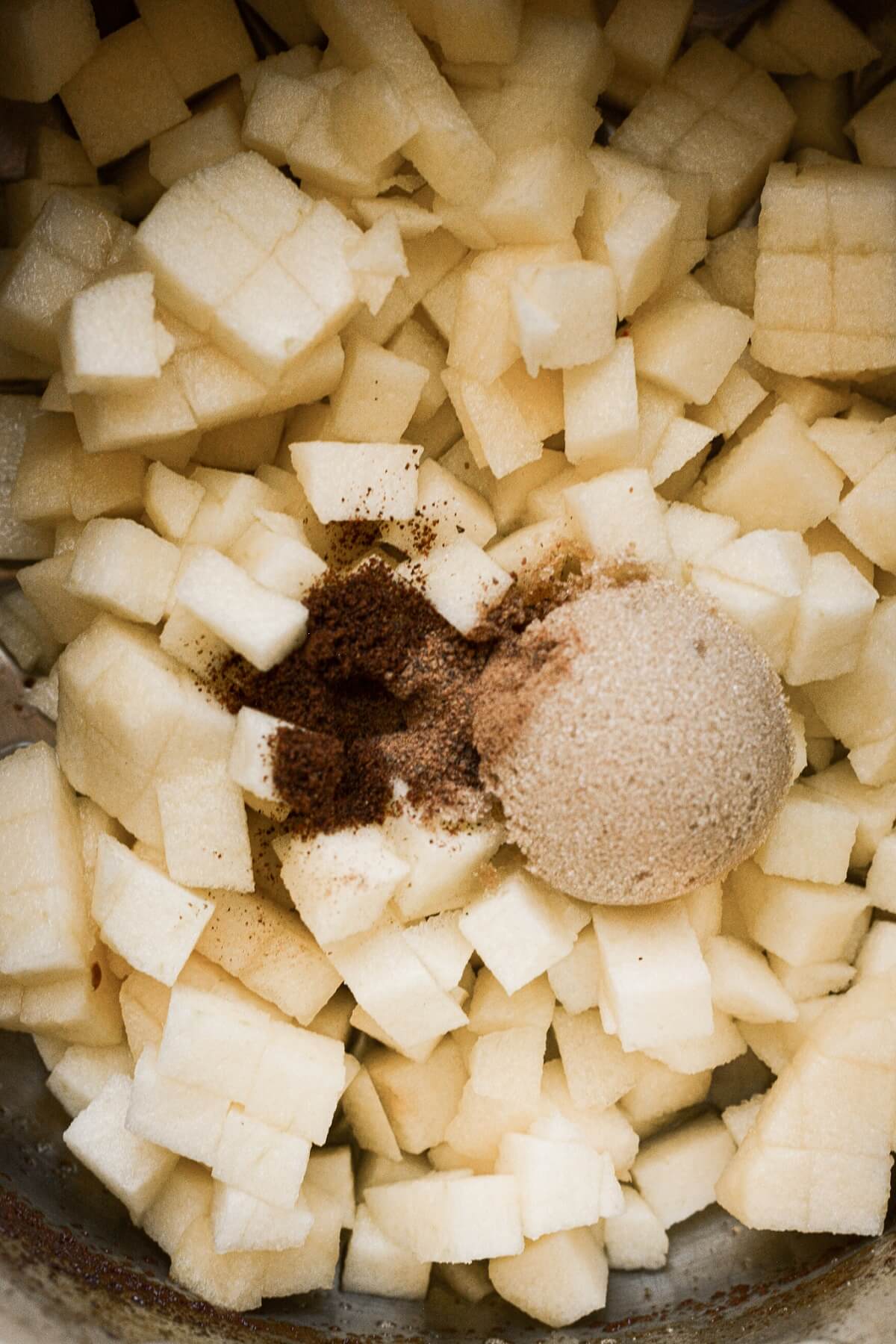 Brown sugar and spices on chopped apples.