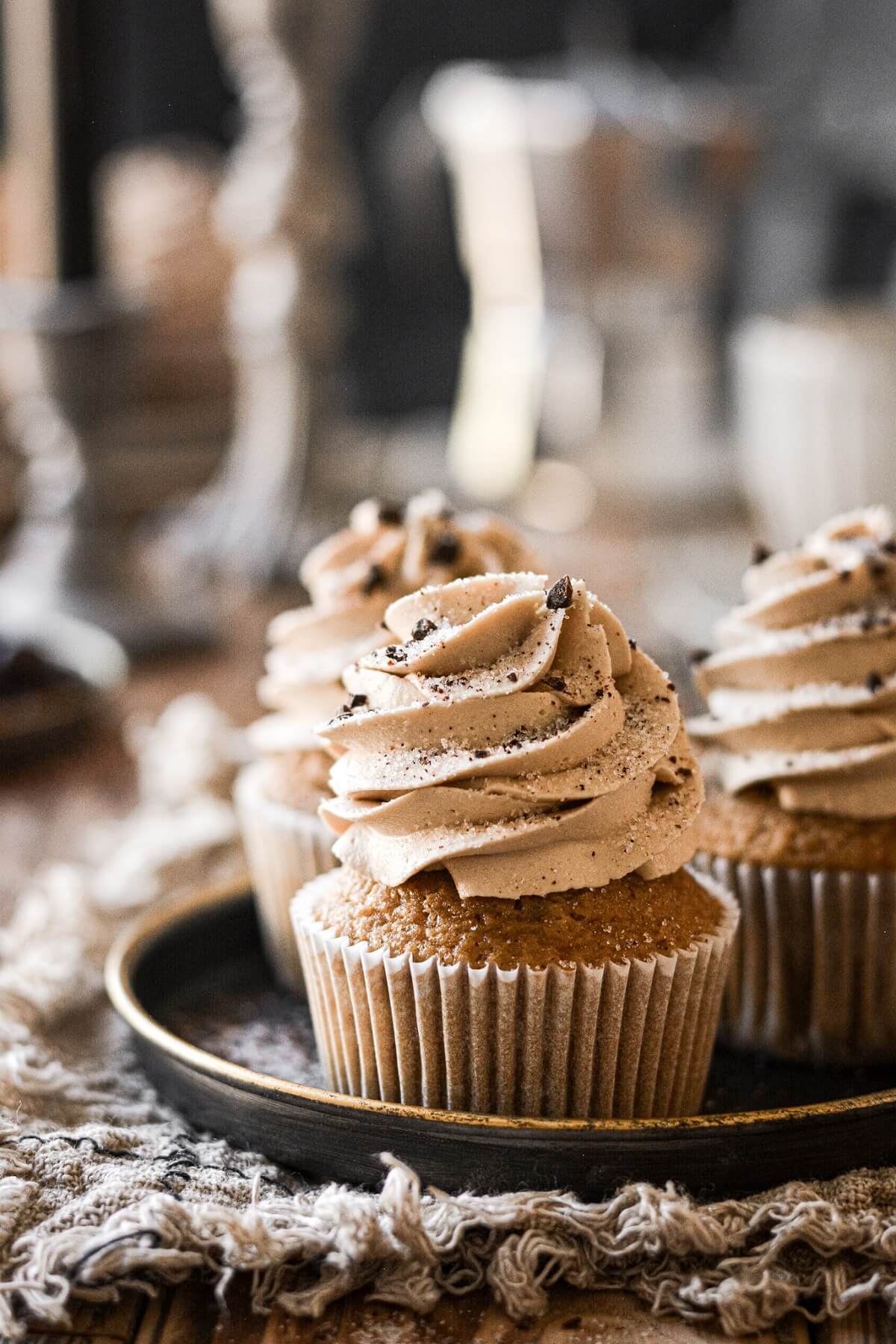 Coffee cupcakes with espresso sugar and chocolate covered espresso beans.