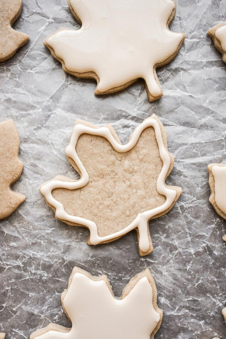 Step 4 for decorating iced maple cut out cookies.