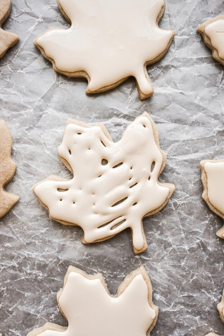 Step 5 for decorating iced maple cut out cookies.