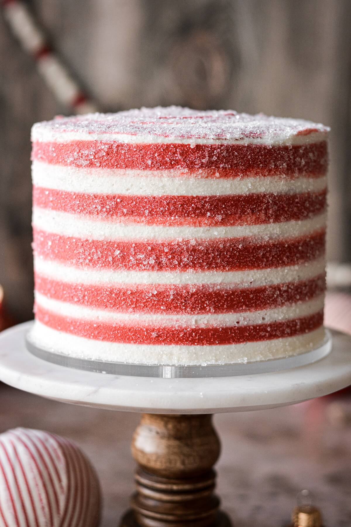 Red and white striped buttercream covered in sparkling sugar.