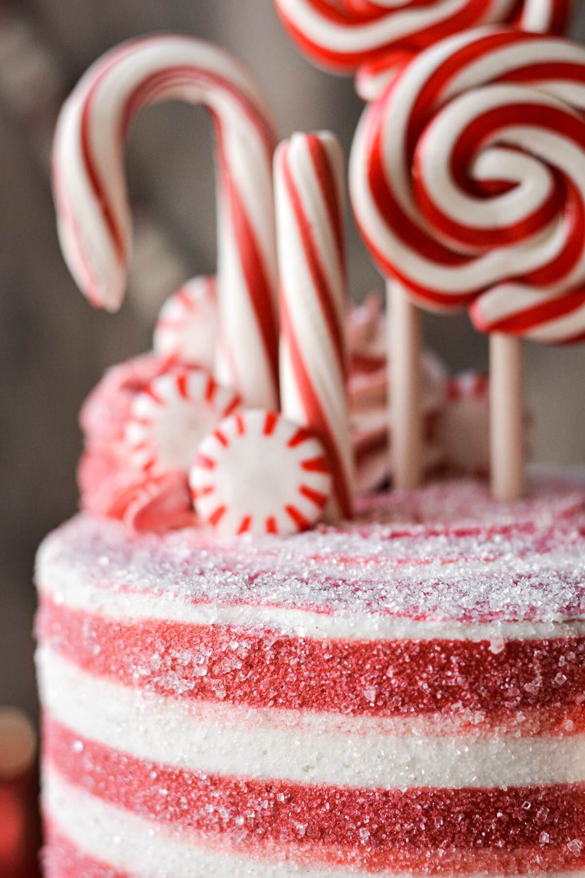 Sparkling sugar on red and white striped buttercream.