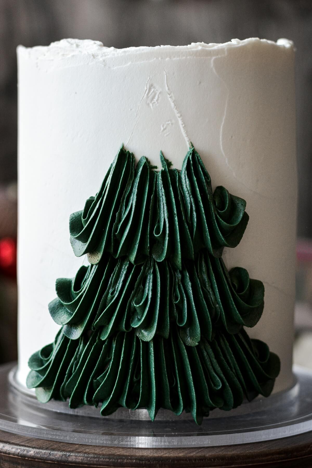 Step 7 for decorating a buttercream Christmas tree cake.