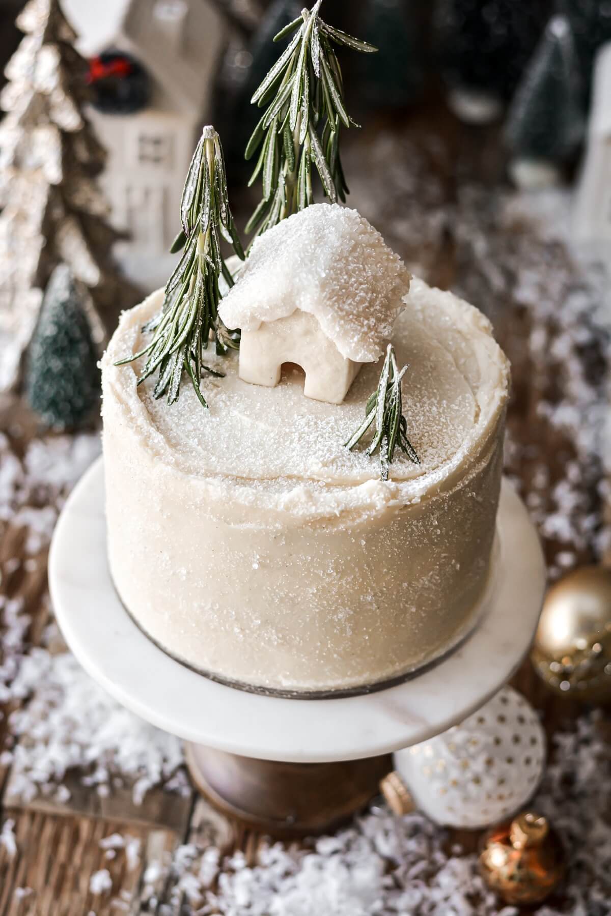 Mascarpone buttercream covered in sparkling sugar, on a gingerbread cake.