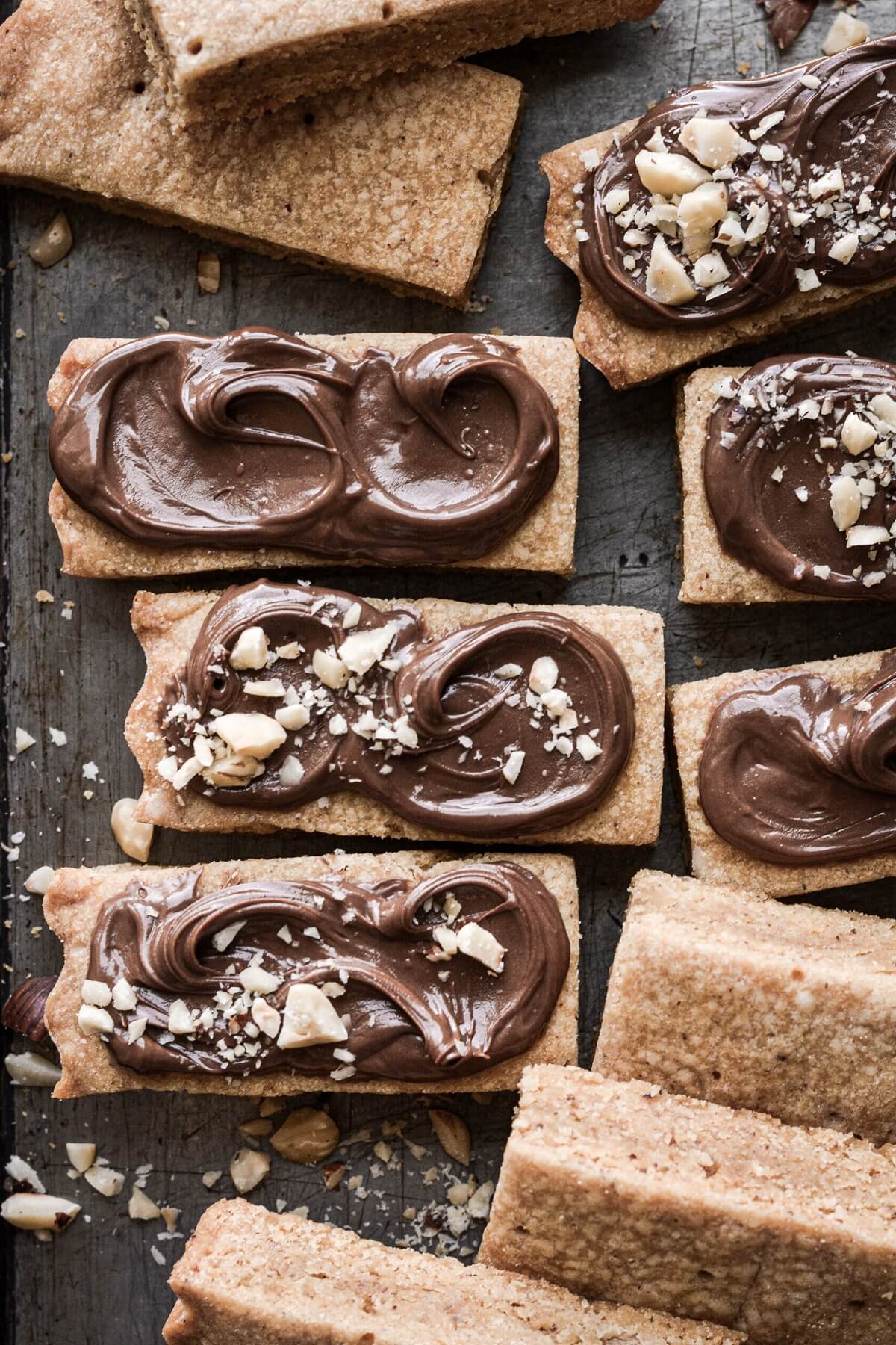 Hazelnut shortbread cut into bars and spread with Nutella.