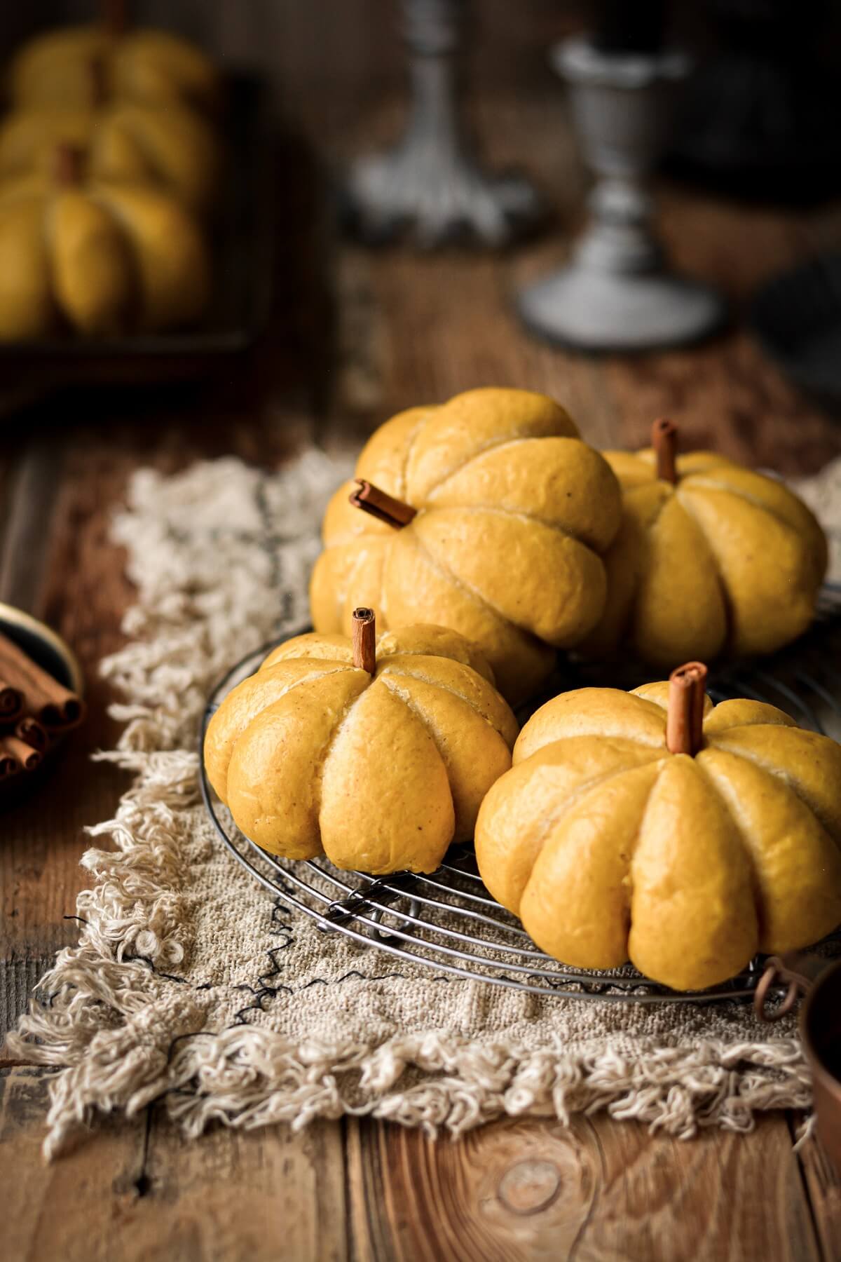 Pumpkin shaped rolls with cinnamon stick stems.