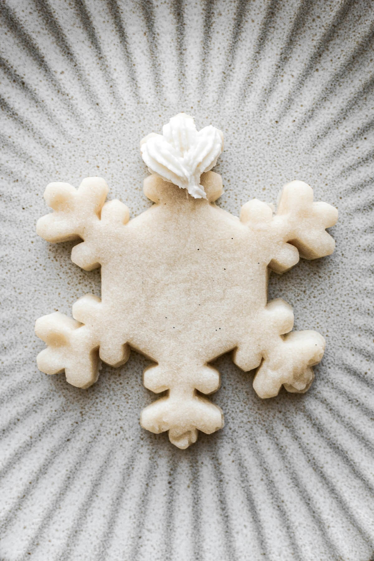 Step 3 for decorating snowflake sugar cookies.