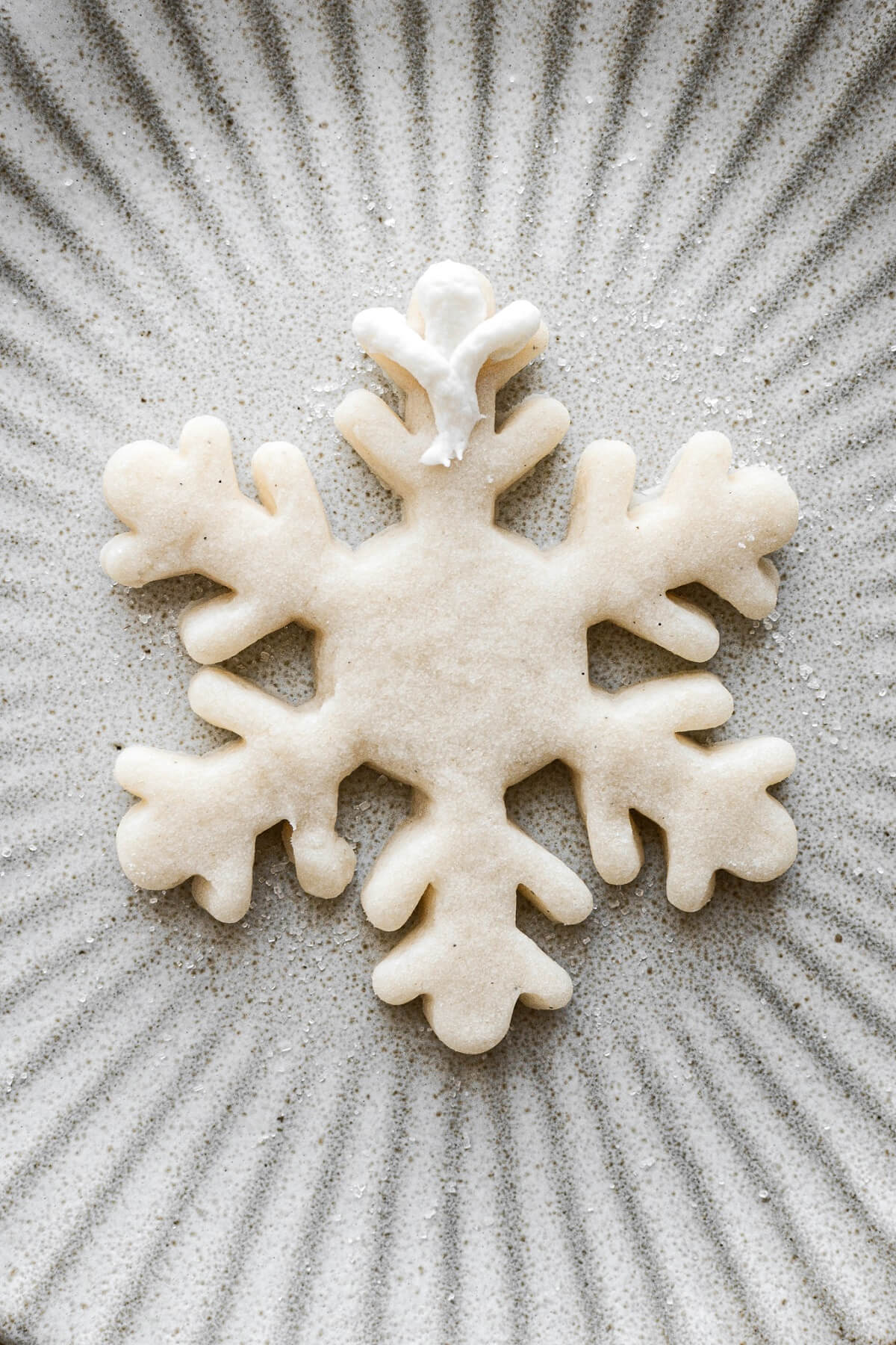 Step 11 for decorating snowflake sugar cookies.