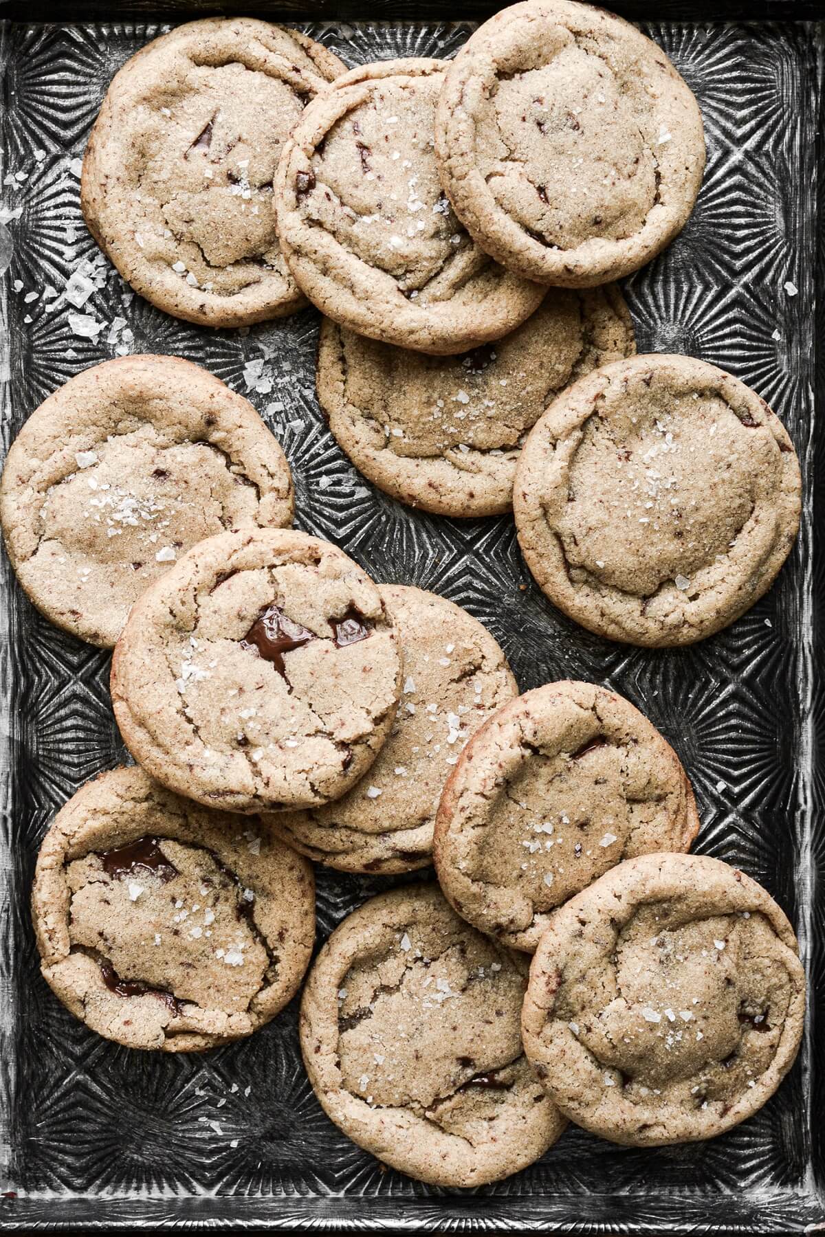 Brown butter chocolate chip cookies on a baking sheet.