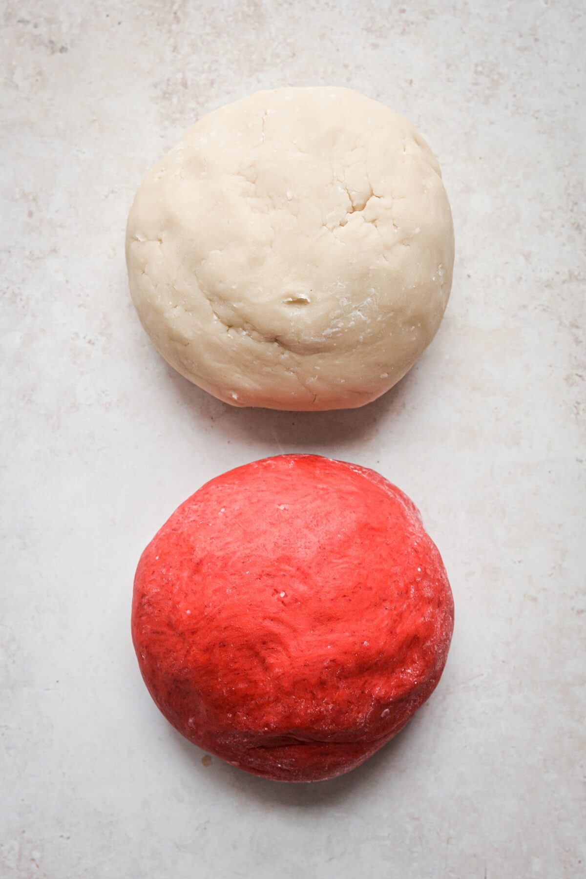 Balls of red and white cookie dough.