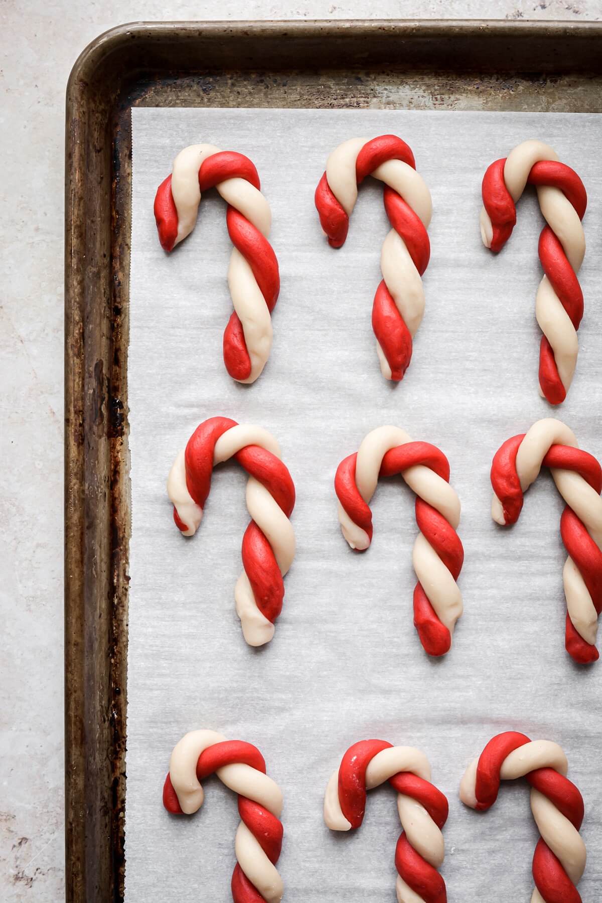 Step 5 for making red and white candy cane cookies.