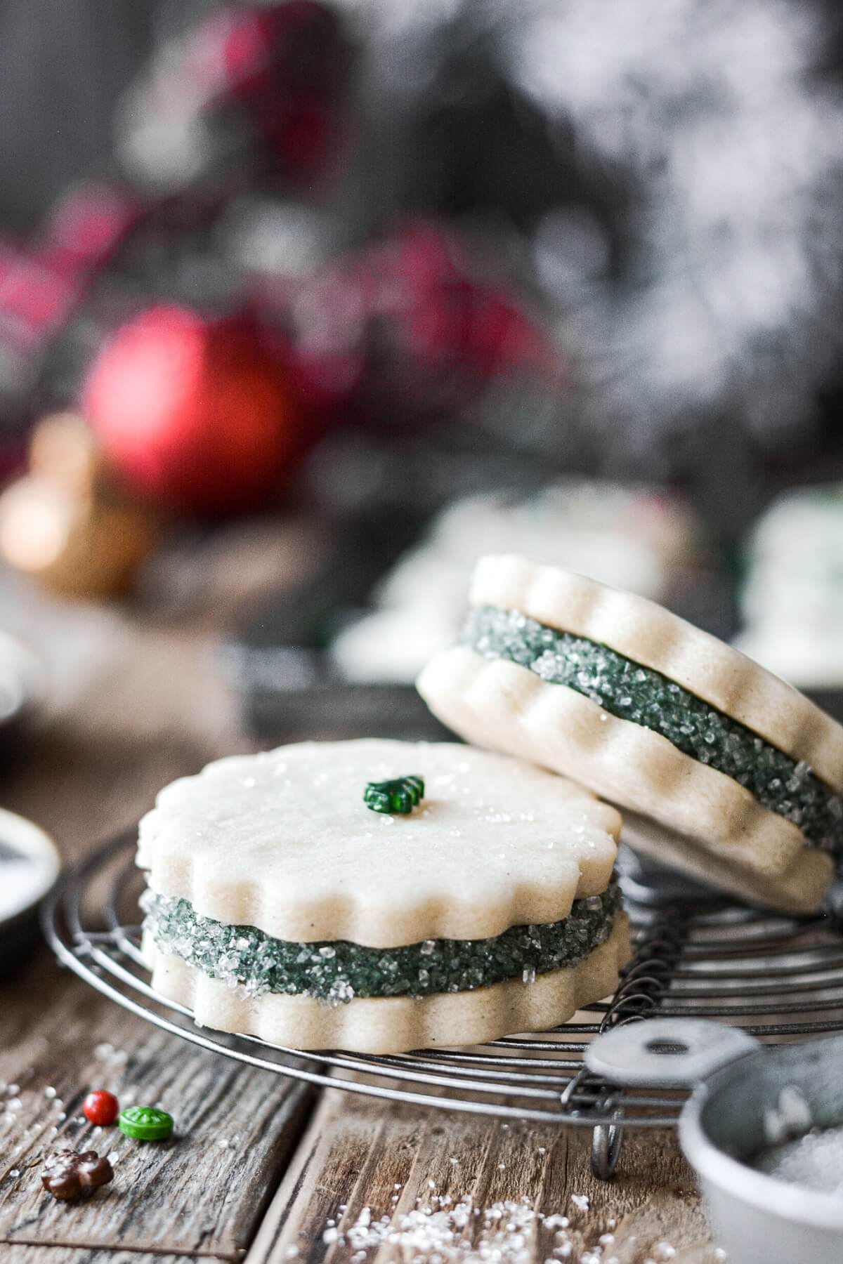 Sugar cookies filled with green buttercream and covered in sparkling sugar.