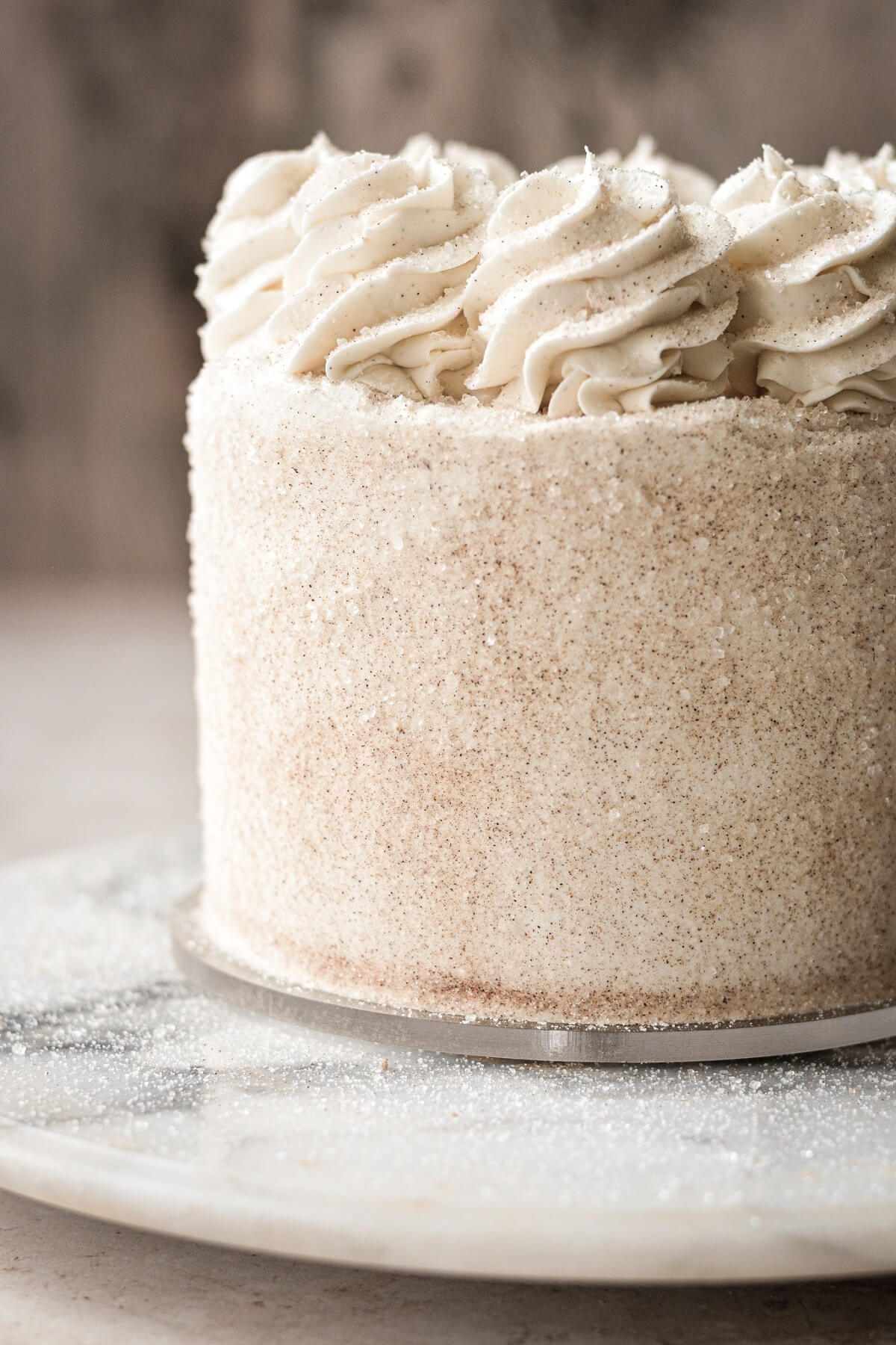 Buttercream swirls on top of a cake.