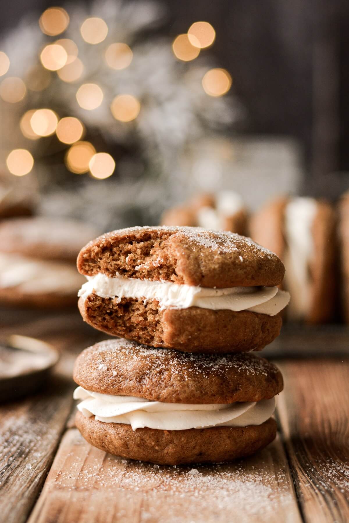 Gingerbread whoopie pie with a bite taken.