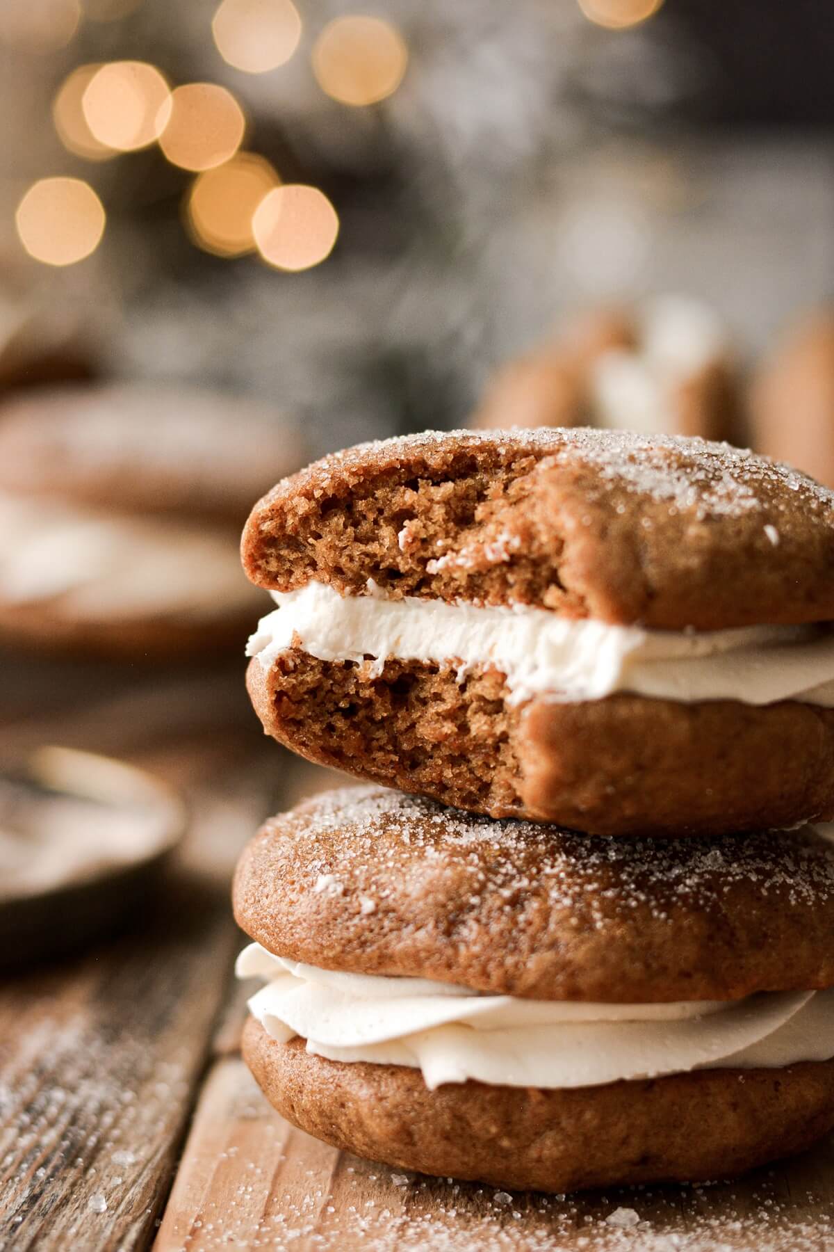 Gingerbread whoopie pie with a bite taken.