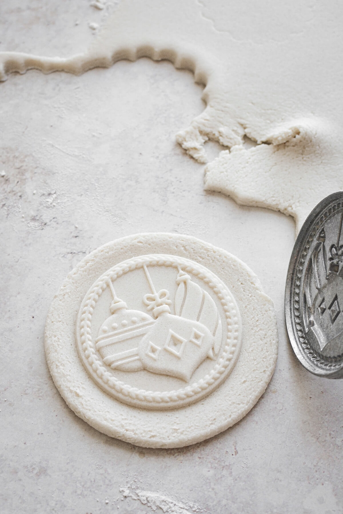 Salt dough pressed with a cookie stamp.