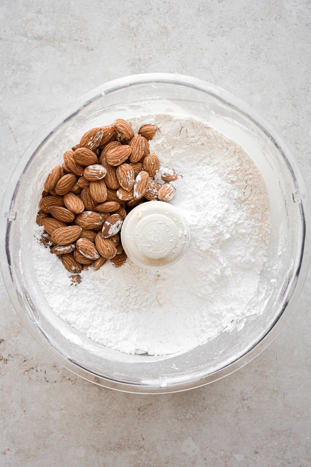 Almonds and flour in a food processor.
