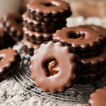 Chocolate linzer cookies with dulce de leche filling.