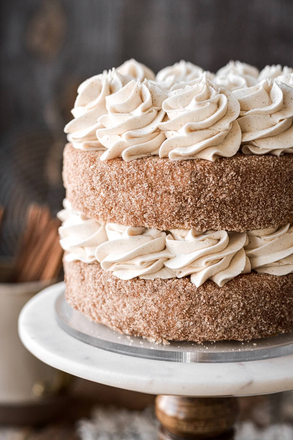 Layers of cinnamon cake coated in cinnamon sugar and filled with piped buttercream.