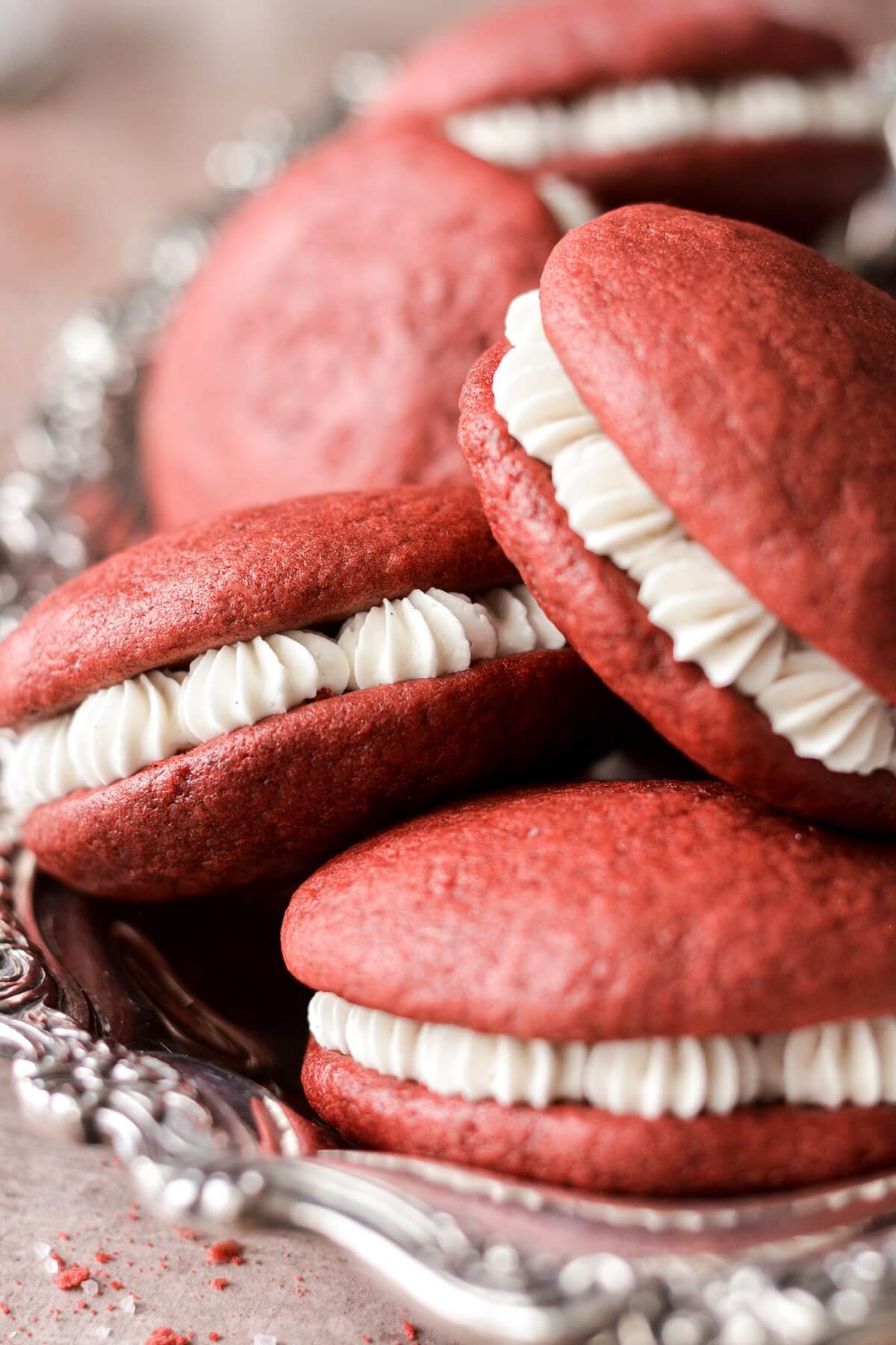 Red velvet whoopie pies with cream cheese filling.