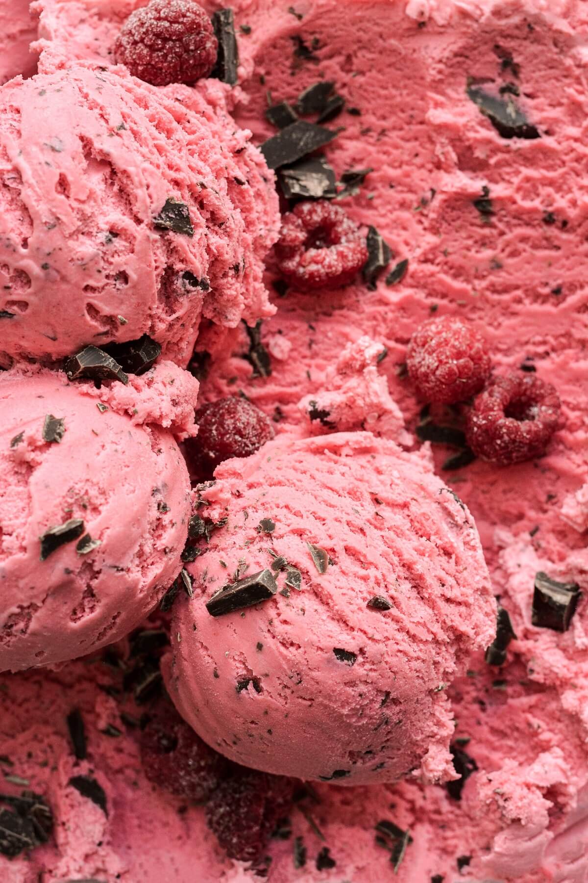 Scoops of raspberry chocolate chunk ice cream.