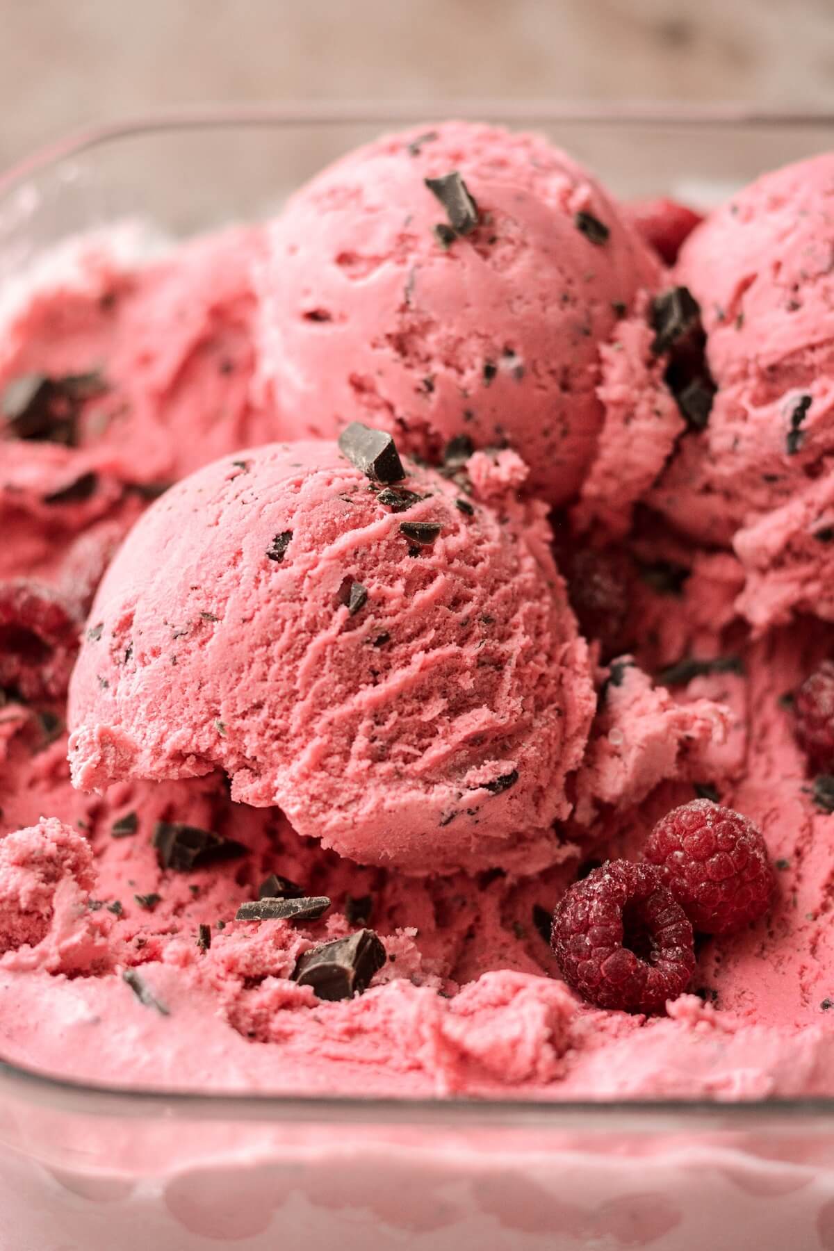 Scoops of raspberry chocolate chunk ice cream.