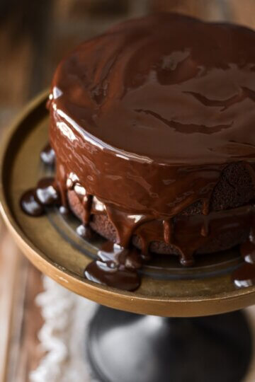 Red wine chocolate cake with ganache dripping over the top.