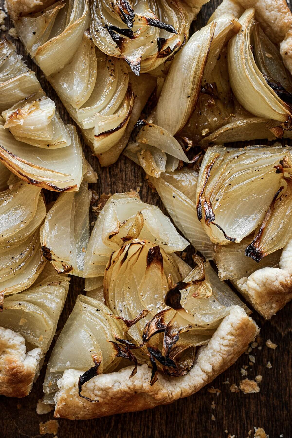 Caramelized onion galette cut into wedges.