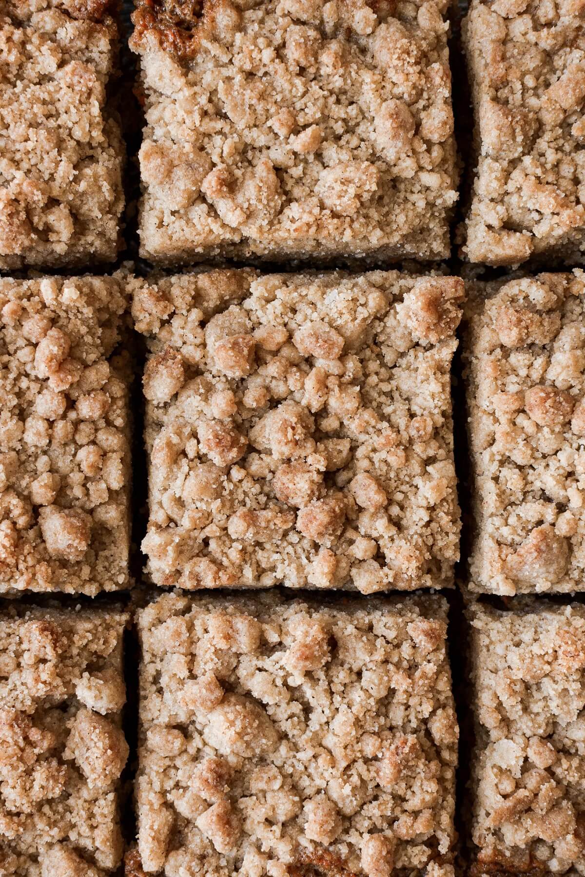 Carrot crumb coffee cake cut into squares.