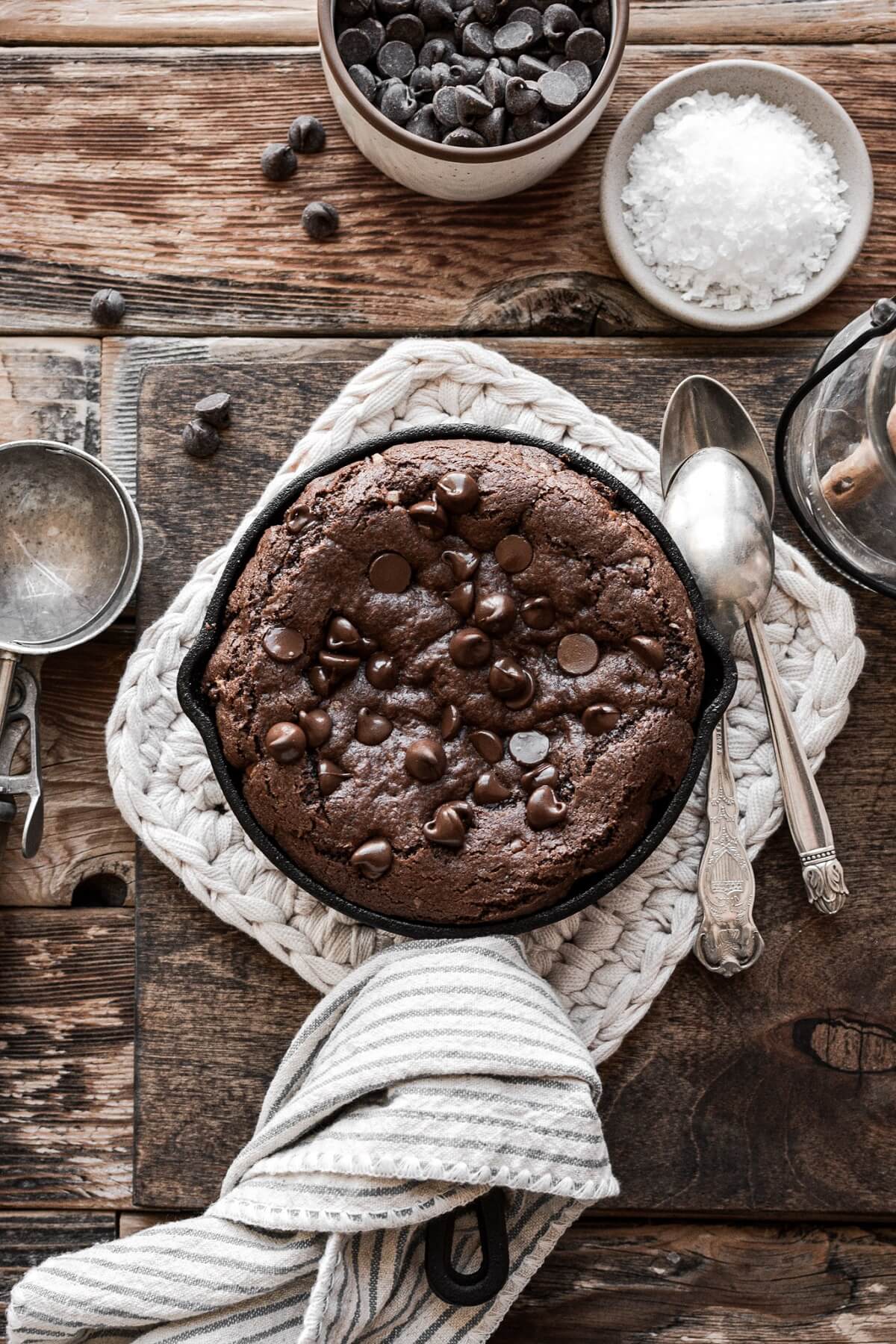 Mini double chocolate skillet cookie on a hot pad.