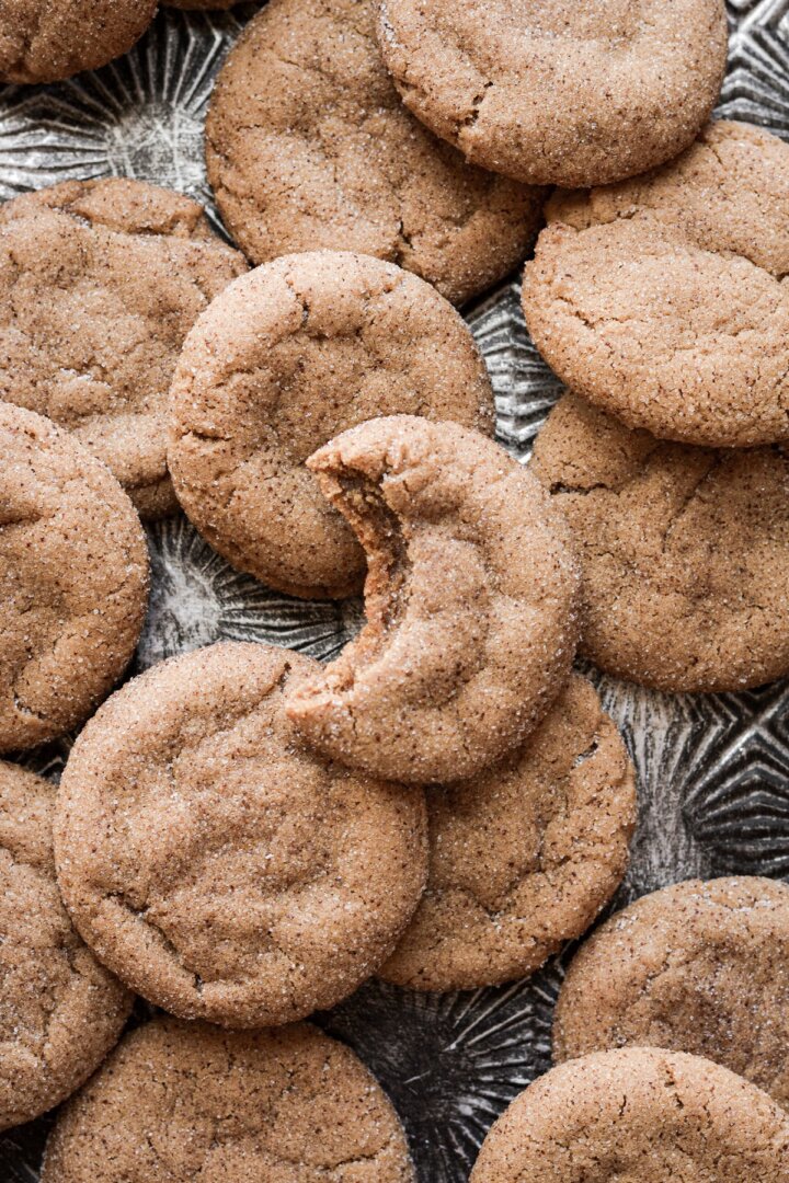 Coffee cookies, one with a bite taken.
