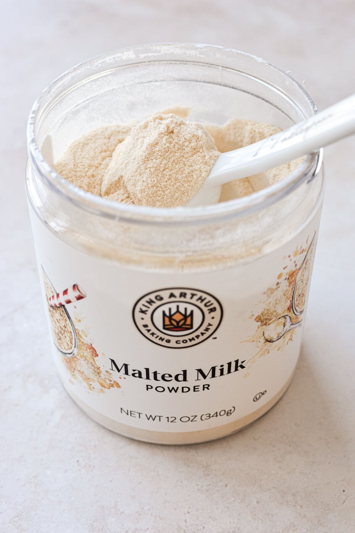 Container of malted milk powder.