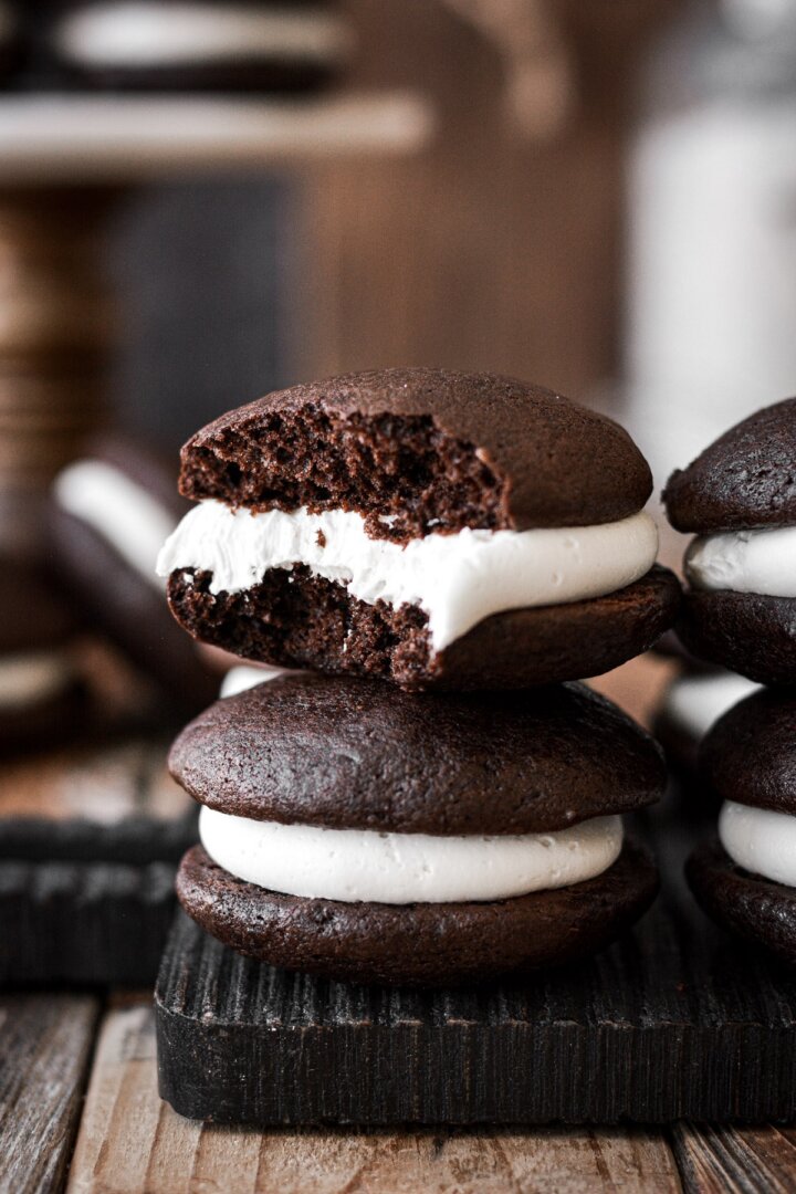 Chocolate whoopie pie with a bite taken.