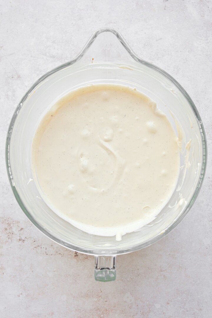 Step 4 for making a classic baked vanilla bean cheesecake.