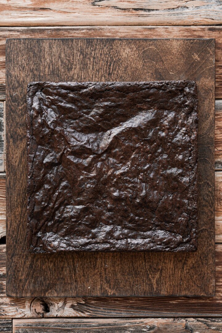 Brownies on a wooden cutting board.