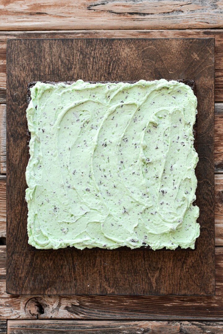 Brownies topped with mint cookies and cream buttercream.