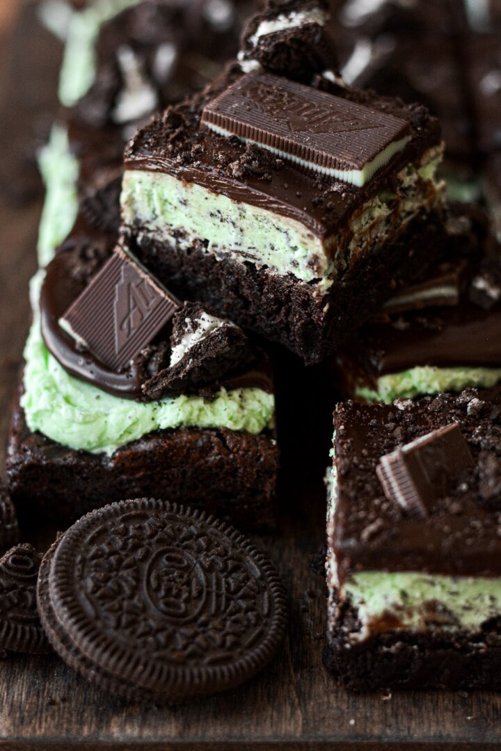 Mint Oreo brownies on a wooden board.