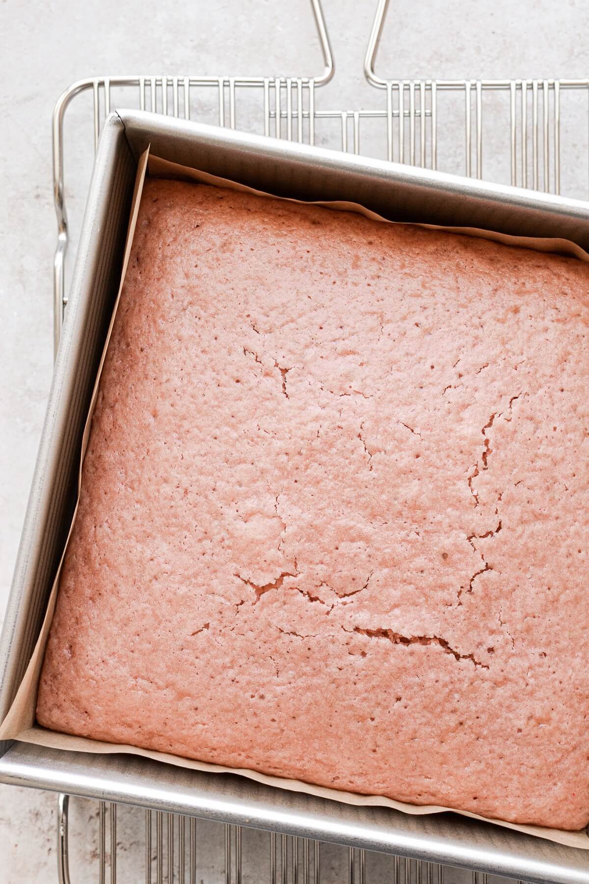 Baked strawberry cake in a baking pan.