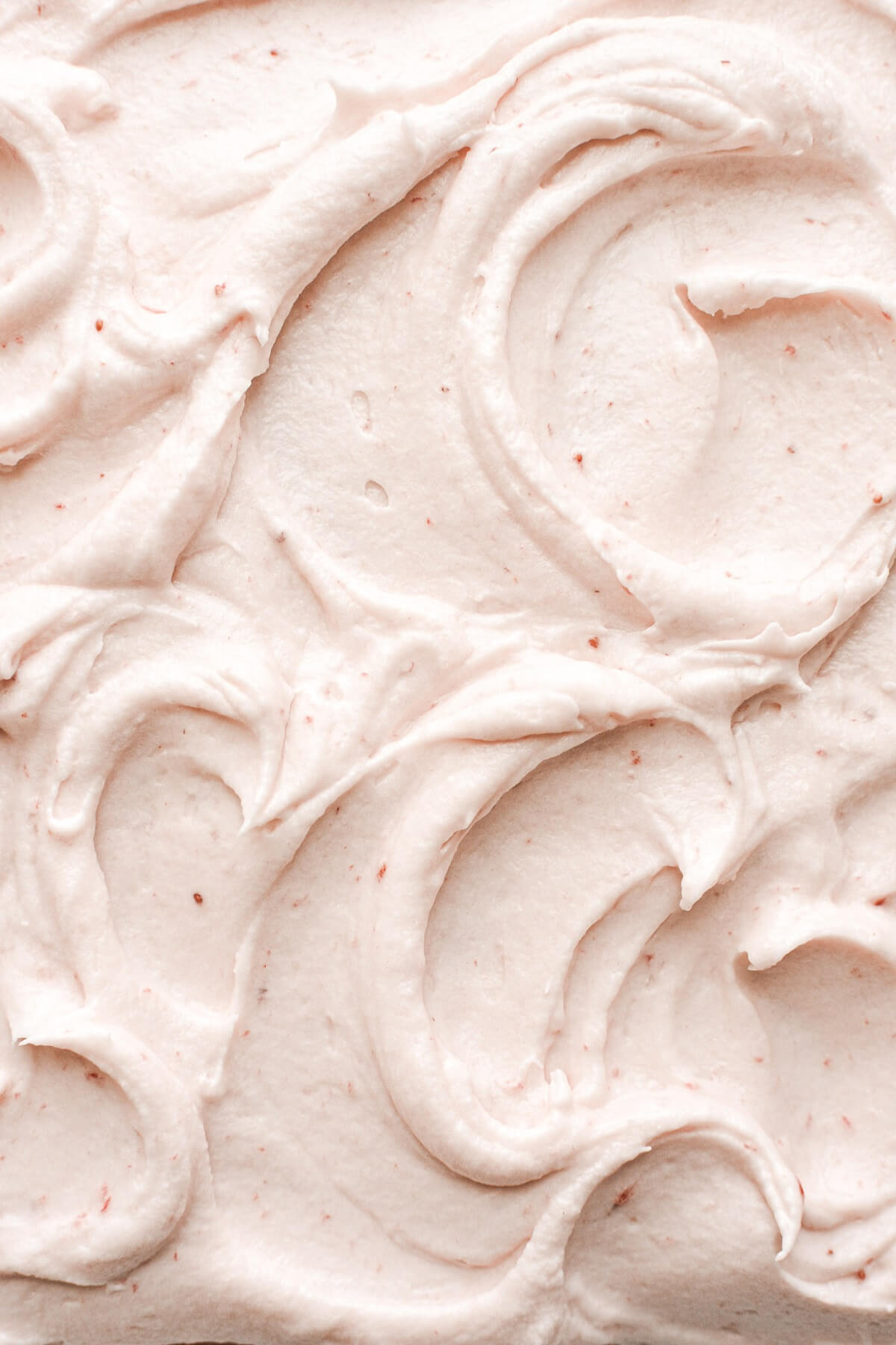 Swirls of strawberry cream cheese frosting.