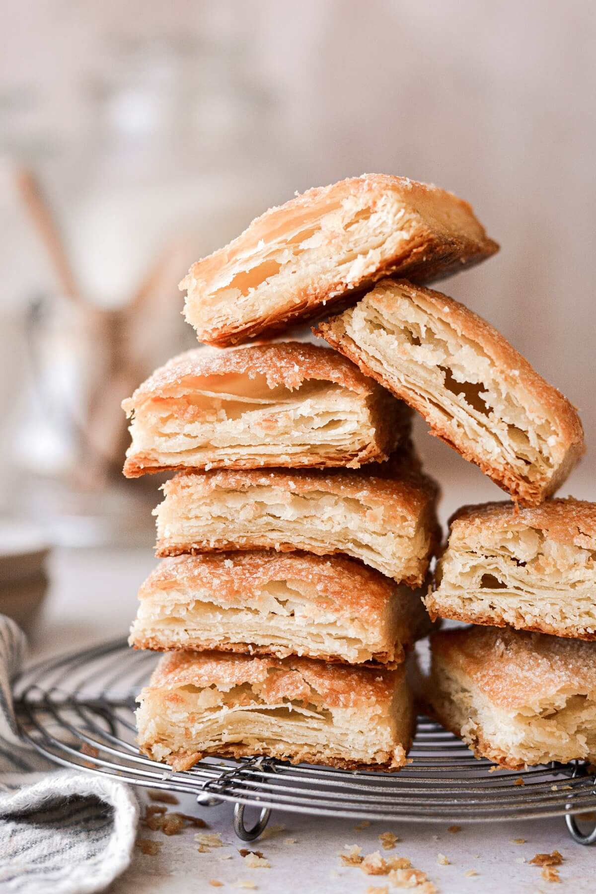 Baked squares of puff pastry on a cooling rack.