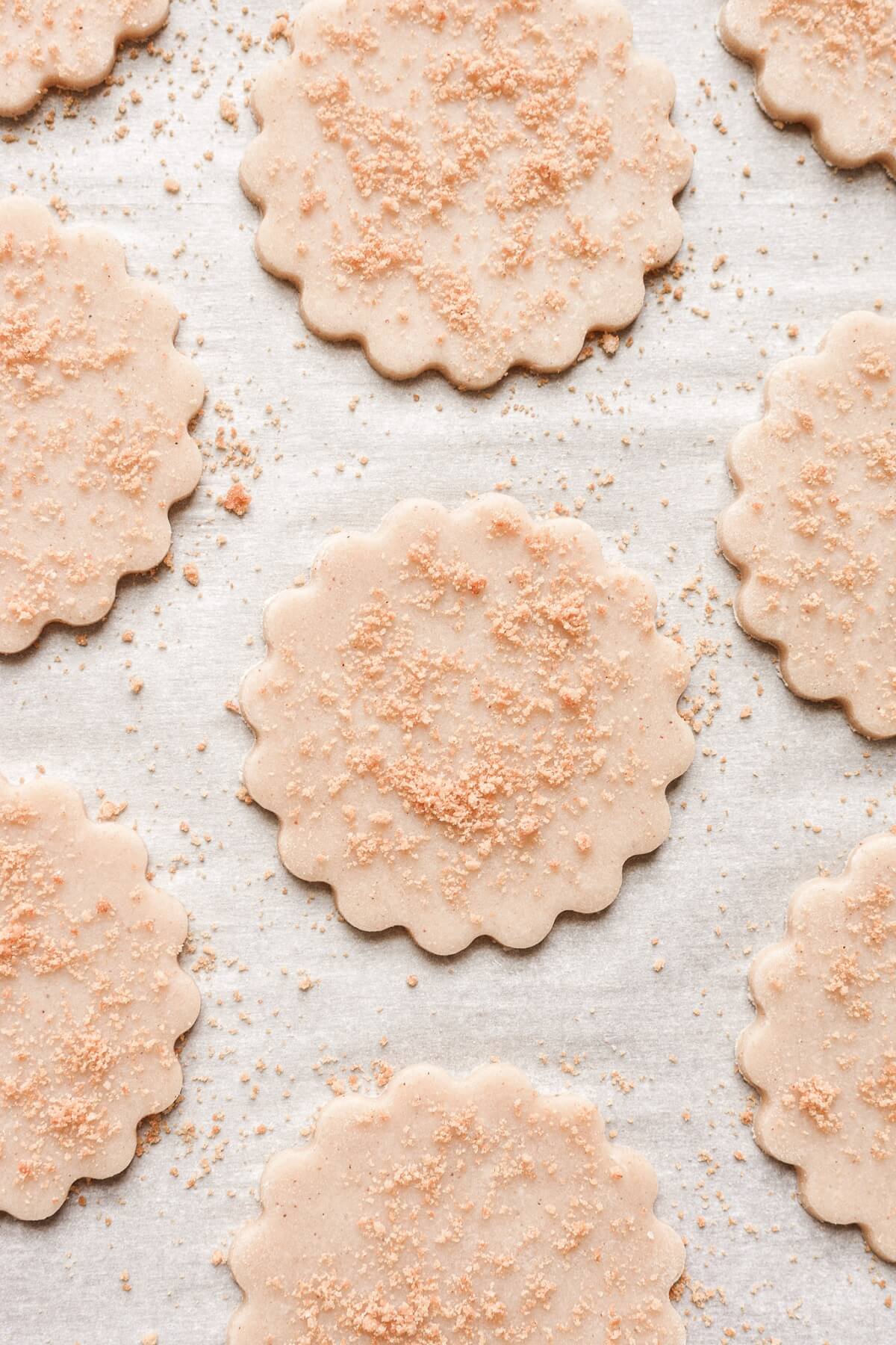 Cutout whole wheat shortbread cookies sprinkled with graham cracker crumbs.