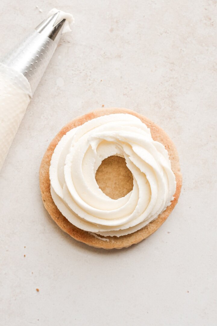 Shortbread cookie with a ring of cream cheese filling.