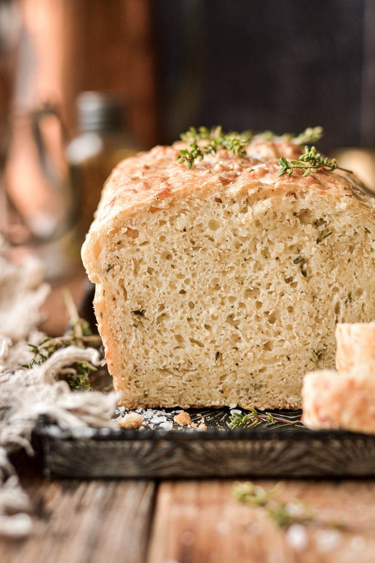 Buttermilk herb bread with a slice cut.