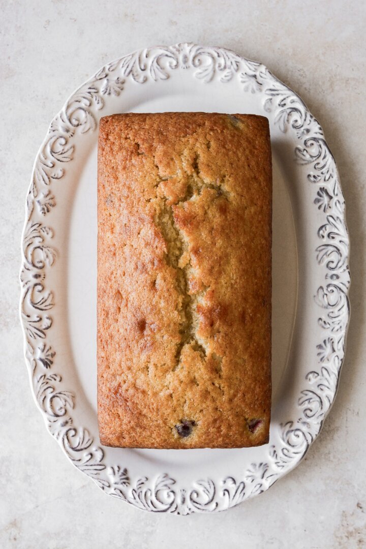 Cherry loaf cake on a plate.
