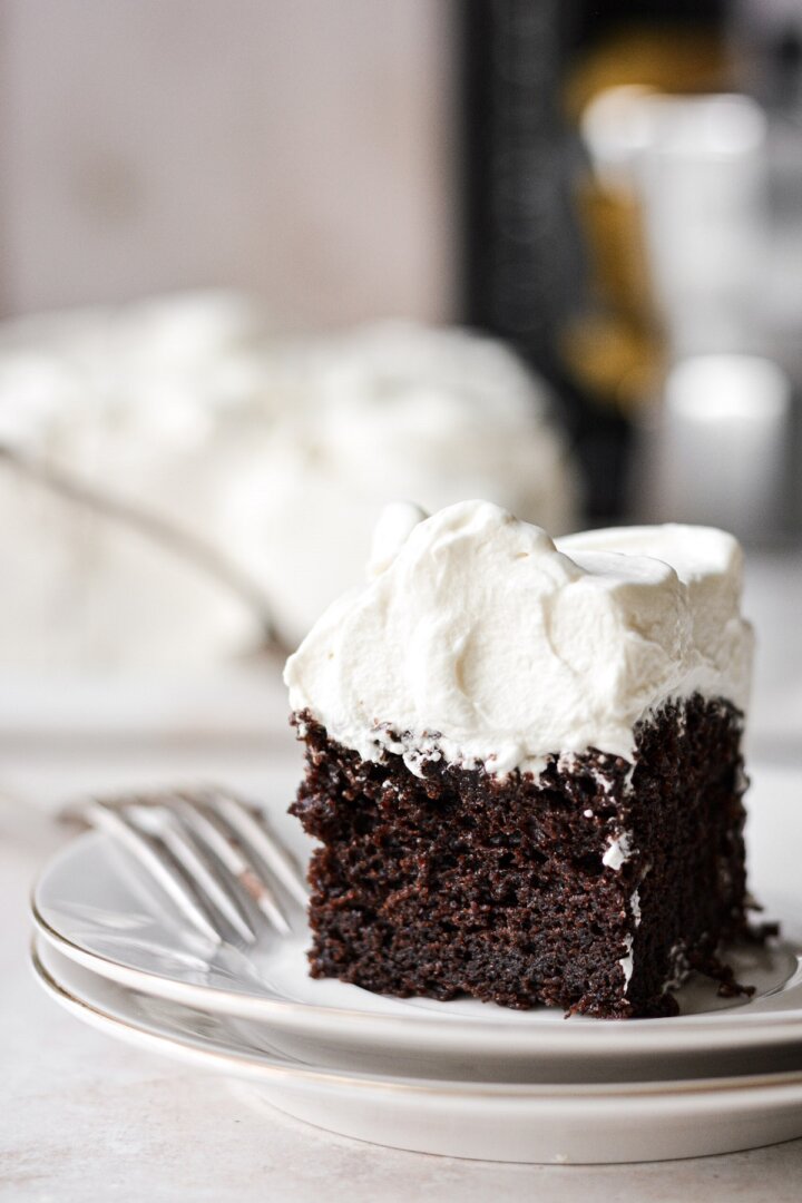 A piece of chocolate cake with Kahlua and cream frosting.