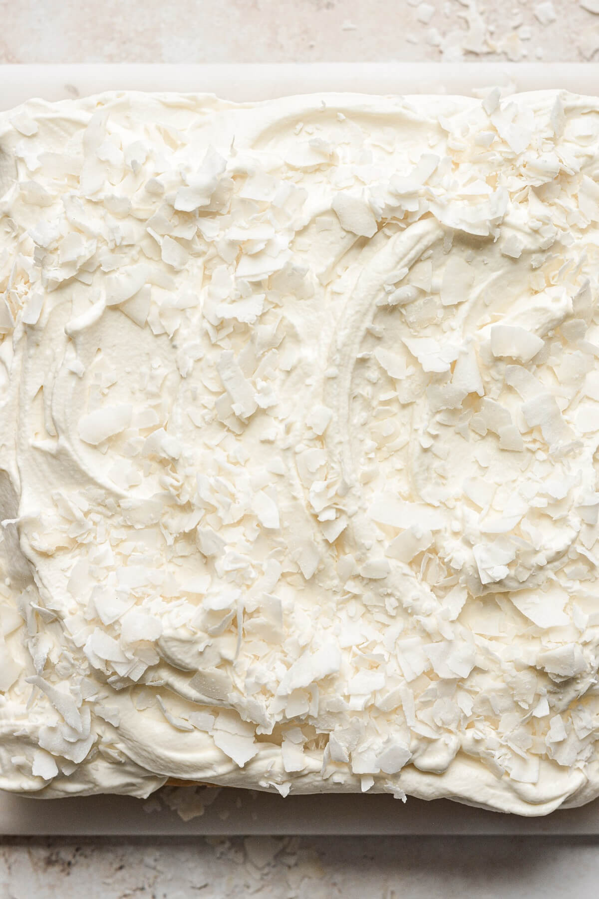 Mascarpone whipped cream sprinkled with coconut.