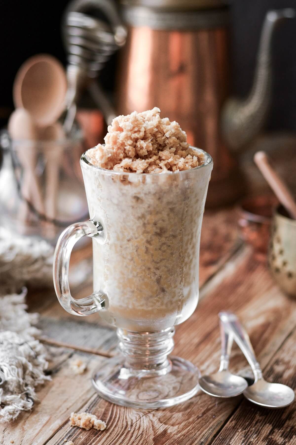 A glass cup filled with coffee and cream granita.